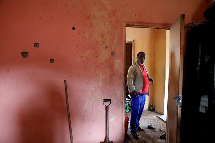 Zibonele Msomi stands in the room where his brother Mvumo was shot dead on December 11.